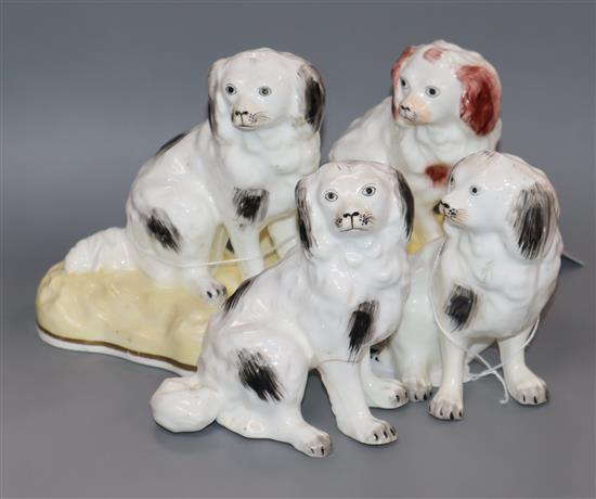 Four Samuel Alcock seated figures of King Charles spaniels, c.1840-50, H. 10.5cm - 12.5cm